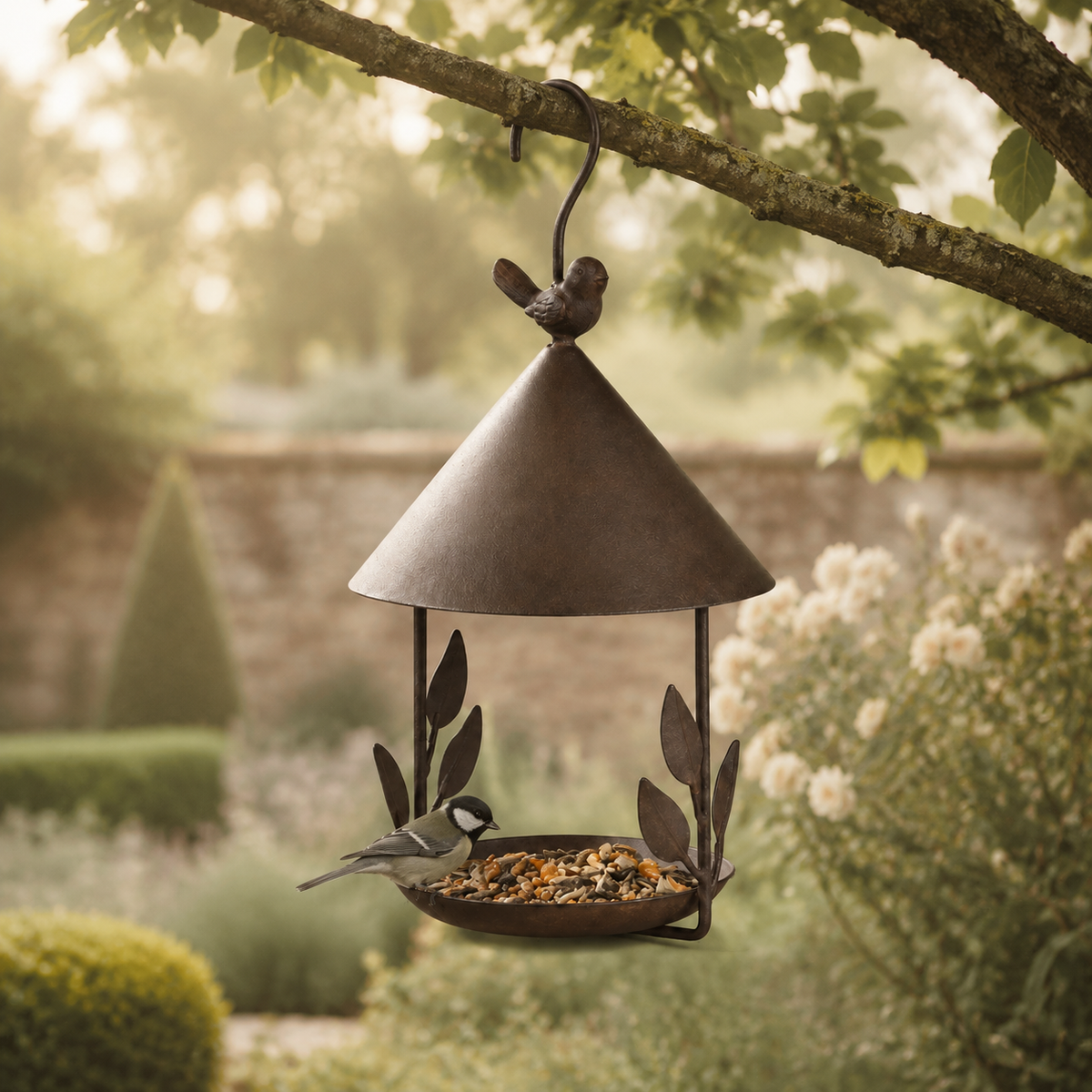 Iron bird feeder hanging in a garden