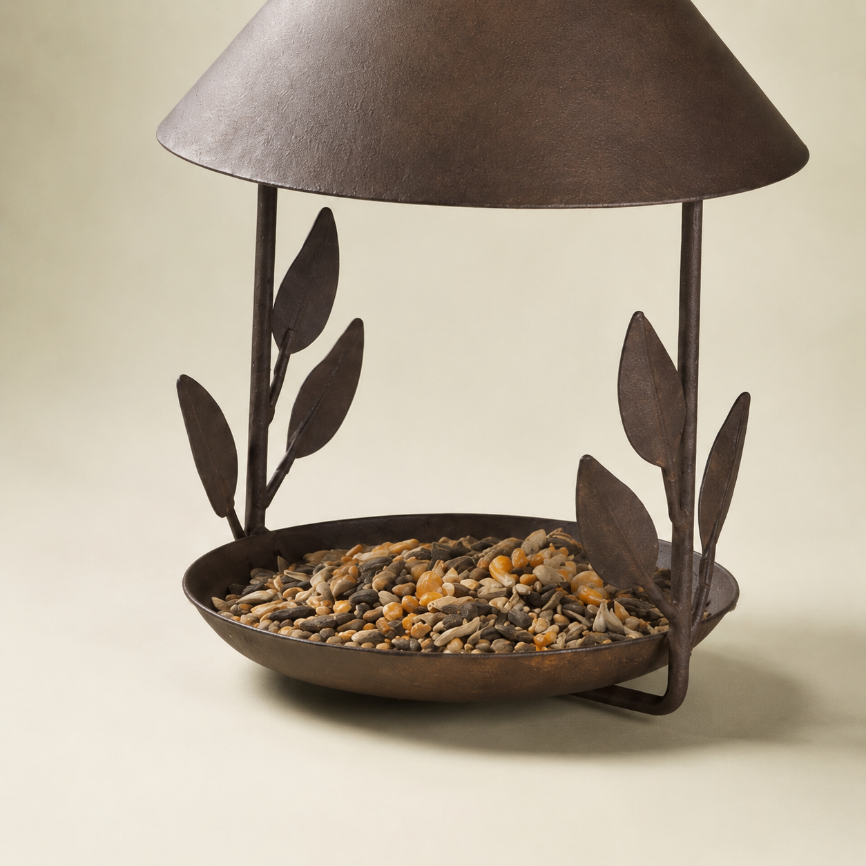 Iron bird feeder seed tray detail